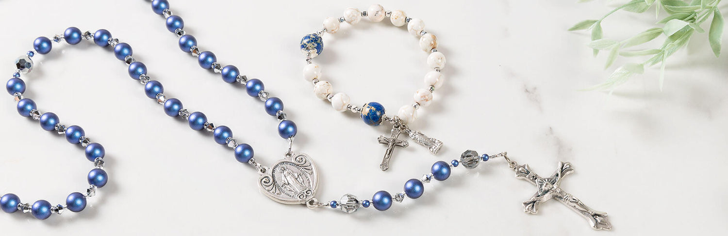 Photo of blue rosary on a white table